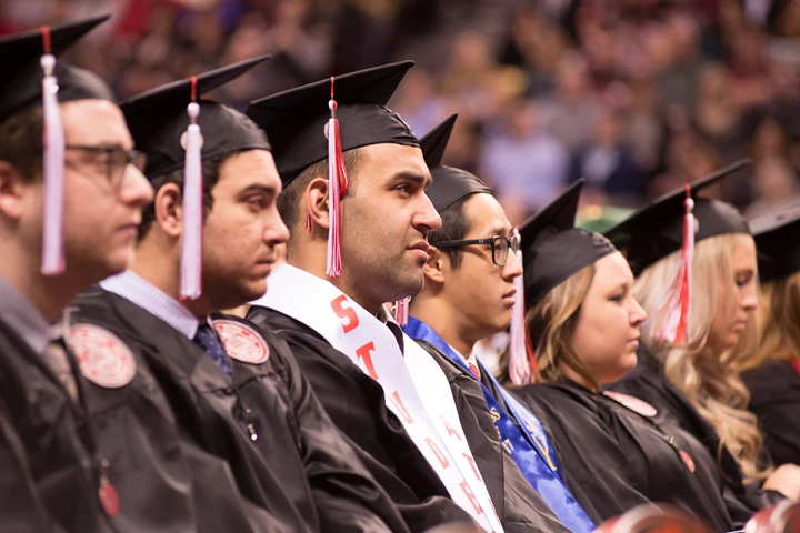 INTO Illinois State Line Of Graduating Students Looking To The Front From The Side